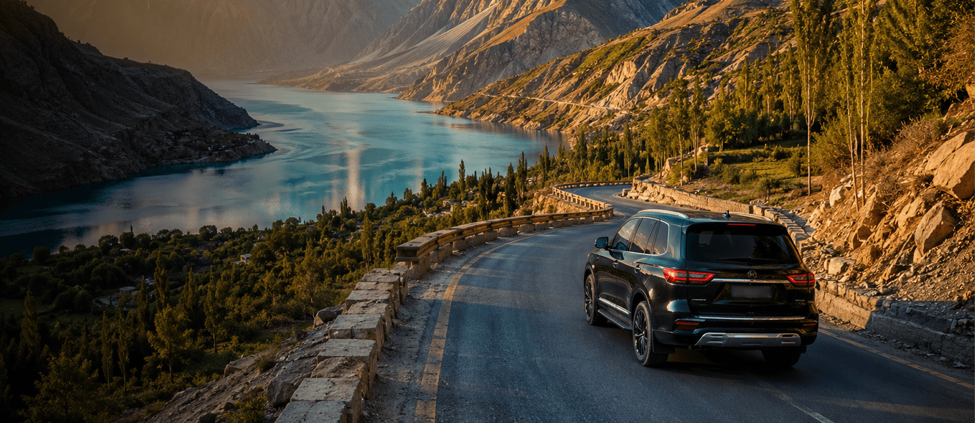 Black SUV on a scenic mountain road in Pakistan for city-to-city chauffeur service
